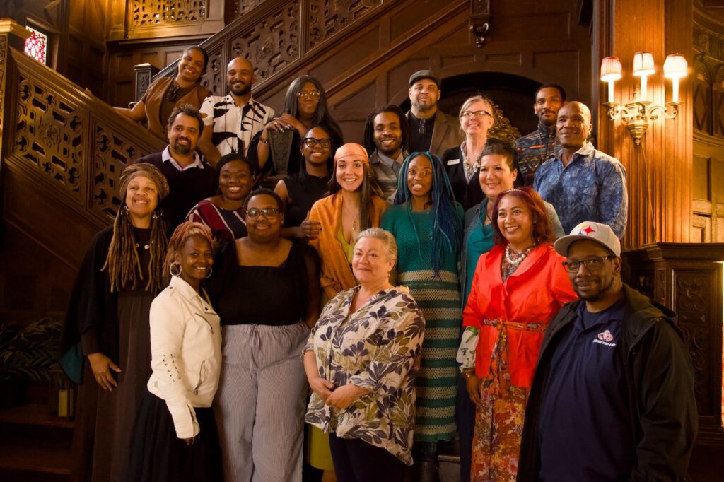 A group gathered on an indoor staircase in Blackshires Leadership Program photography